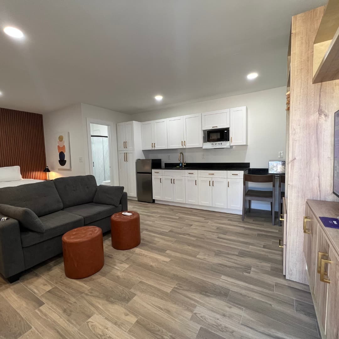 Renovated guest studio with kitchenette — Veras Inn & Suites hospitality remodel by CFL Home Builders